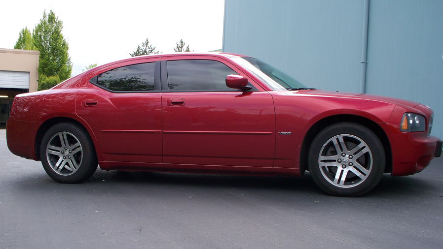 Maroon Dodge Charger with tinted windows