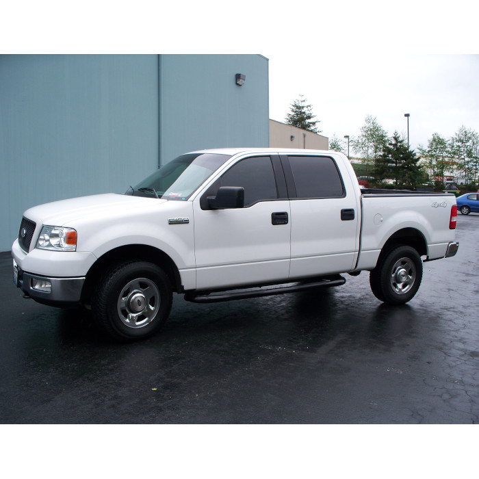 White Ford F150 with tinted windows and visor strip
