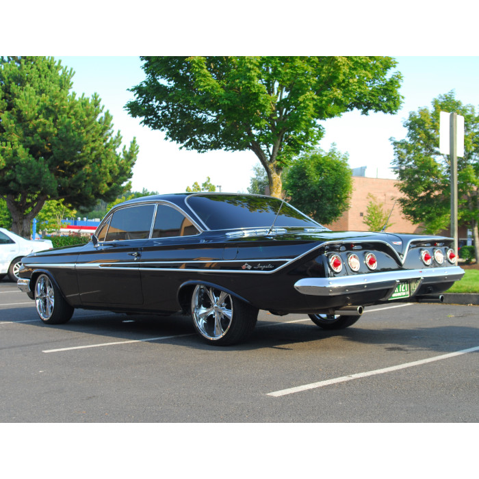 Classic Black Chevrolet Impala with dark tinted windows